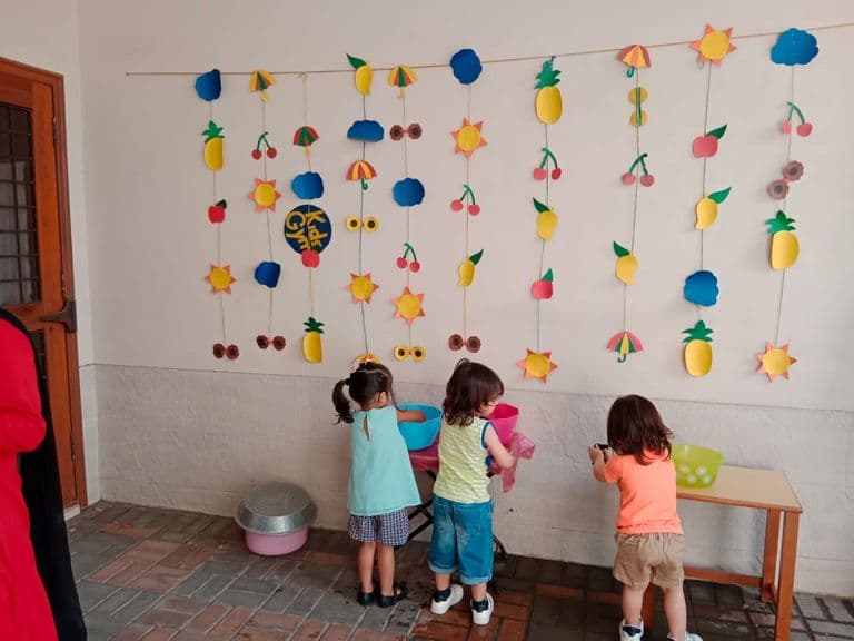 Indoor classroom area with children's artwork displayed on walls