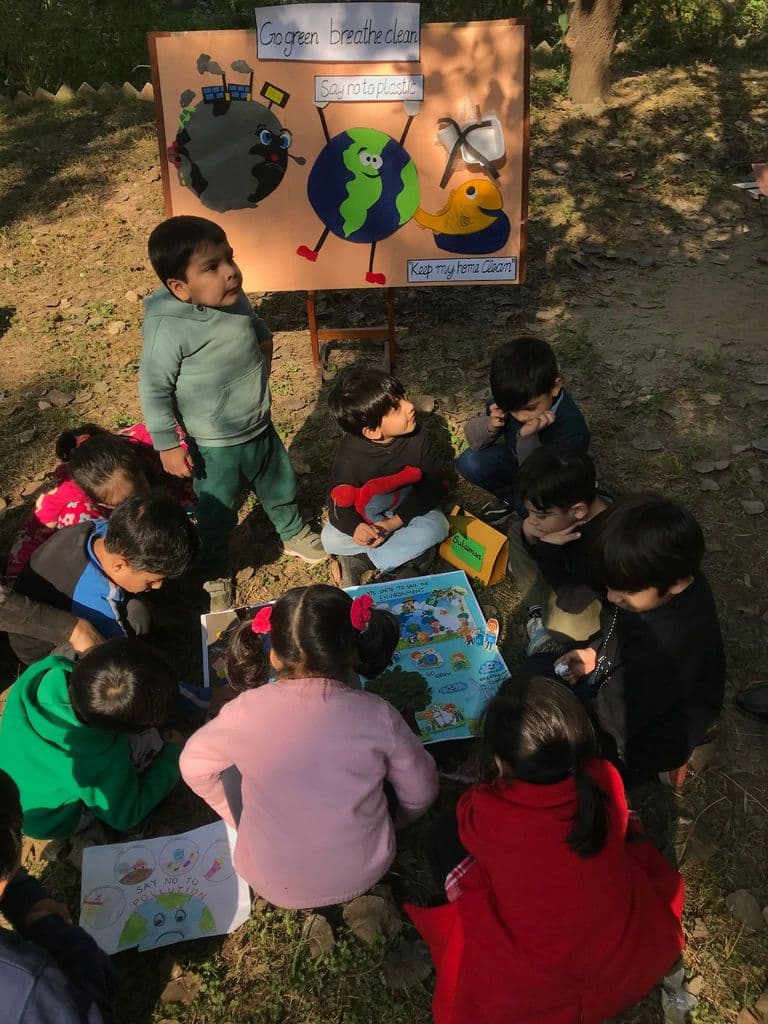 Founder Batool Ishaque guiding children in learning environment